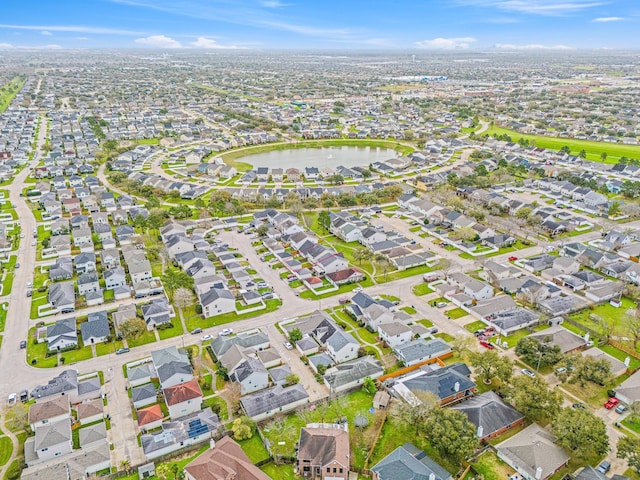 aerial view with a residential view and a water view