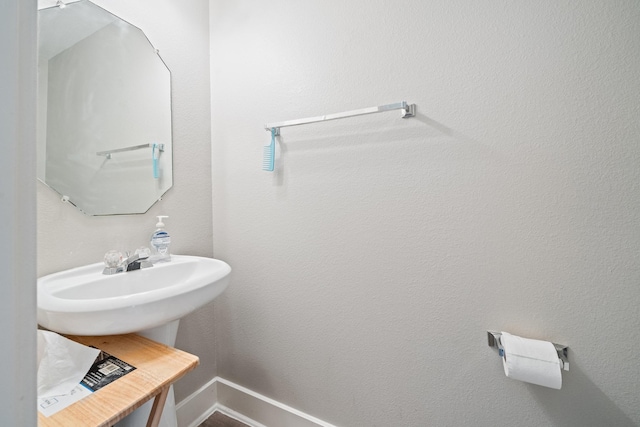 bathroom featuring baseboards