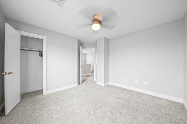 unfurnished bedroom with carpet flooring, baseboards, and visible vents