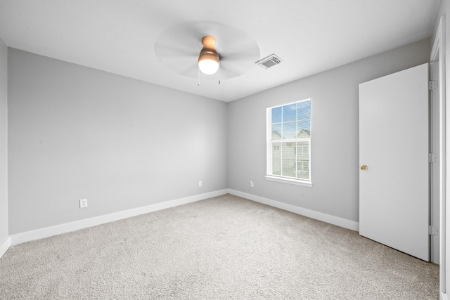 interior space featuring visible vents, carpet floors, baseboards, and a ceiling fan