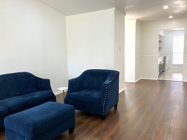 living area with recessed lighting, wood finished floors, and baseboards