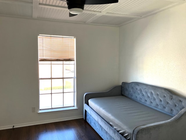 bedroom with baseboards and wood-type flooring