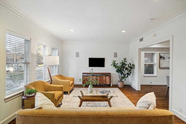 living area with crown molding, recessed lighting, wood finished floors, and baseboards