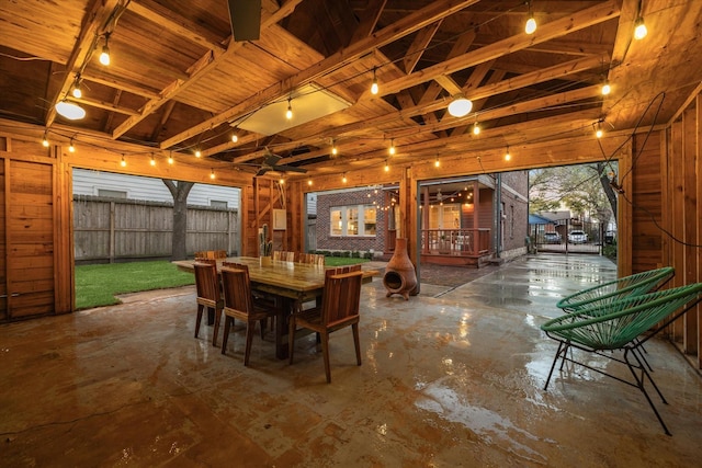 view of patio with outdoor dining space and fence