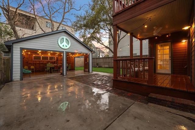 view of patio / terrace with a ceiling fan and fence