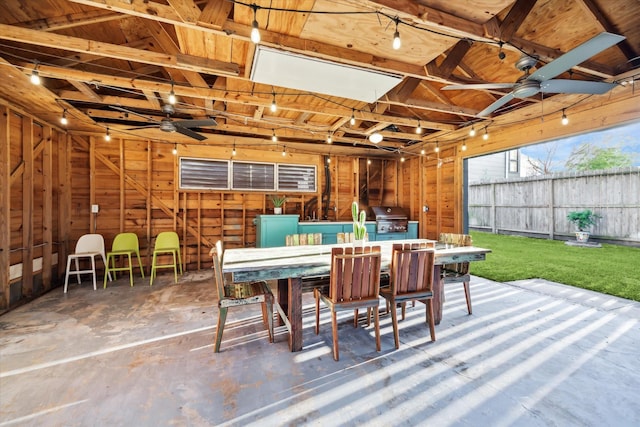 view of patio / terrace featuring outdoor dining area, grilling area, a ceiling fan, and fence