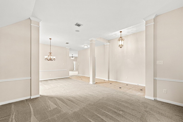 unfurnished room featuring baseboards, visible vents, carpet floors, an inviting chandelier, and decorative columns