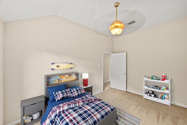 bedroom featuring visible vents, carpet flooring, baseboards, and lofted ceiling