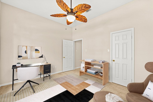 office space featuring light colored carpet, baseboards, and ceiling fan