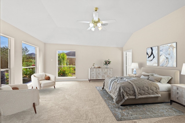 carpeted bedroom featuring baseboards, lofted ceiling, and ceiling fan