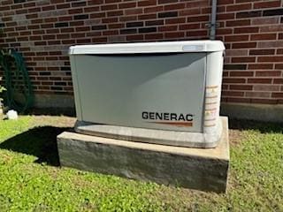 details featuring brick siding and a power unit