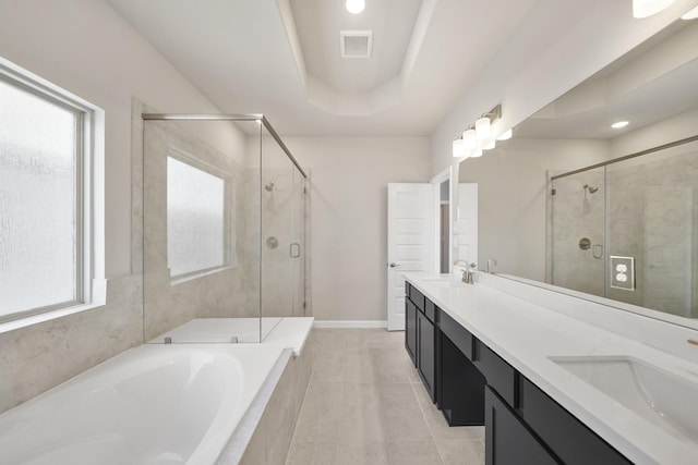 5615 Iris Harvest Dr, Houston, TX 77091 - full bath featuring a garden tub, plenty of natural light, double vanity, a stall shower, and recessed lighting