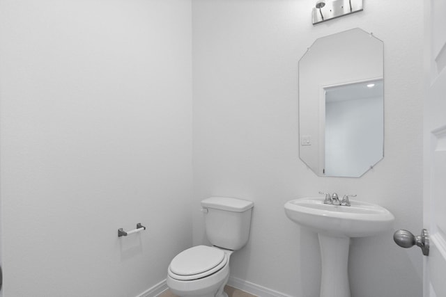 11837 E Gate Dr, Willis, TX 77318 - half bathroom with baseboards and toilet