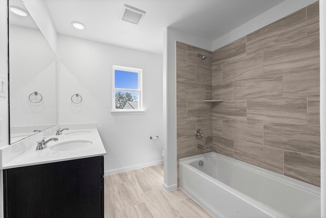 11837 E Gate Dr, Willis, TX 77318 - bathroom with visible vents, baseboards, toilet, double vanity, and a sink