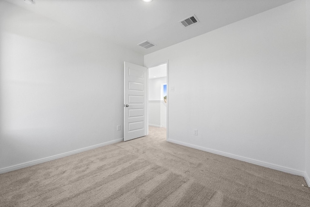 11837 E Gate Dr, Willis, TX 77318 - unfurnished room with visible vents, light carpet, and baseboards