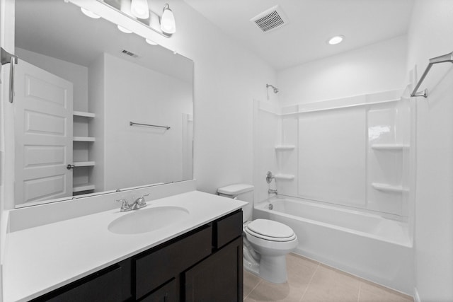 11837 E Gate Dr, Willis, TX 77318 - bathroom featuring visible vents, toilet, vanity, tile patterned flooring, and shower / bathtub combination