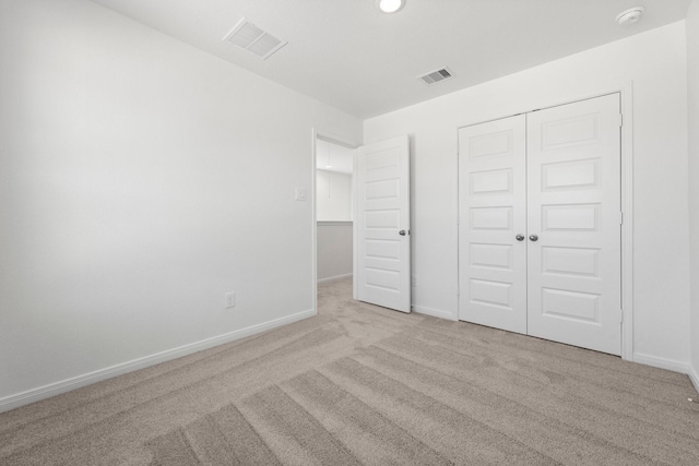 11837 E Gate Dr, Willis, TX 77318 - unfurnished bedroom with a closet, visible vents, baseboards, and carpet floors