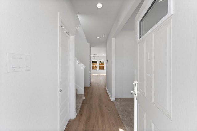 11837 E Gate Dr, Willis, TX 77318 - hallway with recessed lighting, baseboards, wood finished floors, and stairs