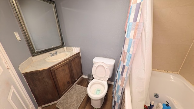 bathroom with vanity, shower / bath combination with curtain, toilet, and wood finished floors