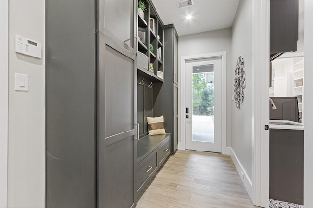 mudroom with recessed lighting, baseboards, visible vents, and light wood-type flooring