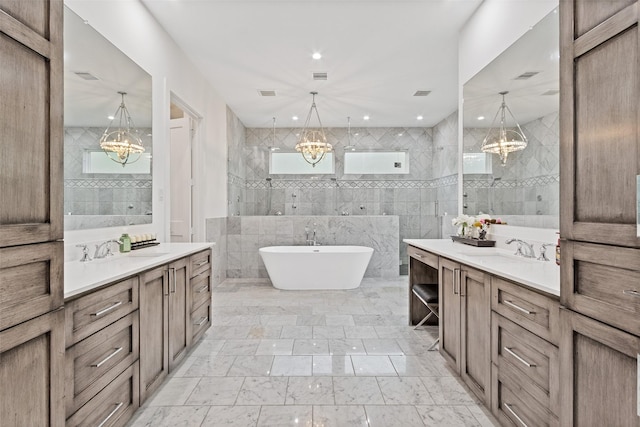 full bath featuring a chandelier, tile walls, and walk in shower