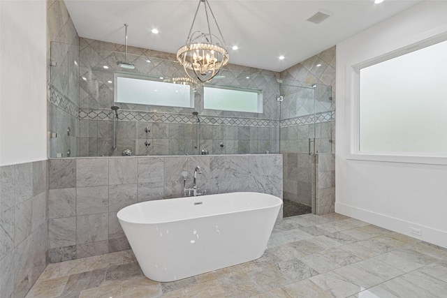 full bath featuring visible vents, marble finish floor, a stall shower, recessed lighting, and a freestanding bath