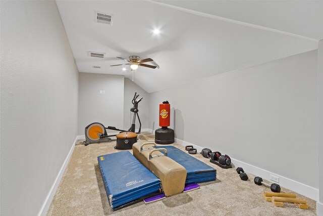 workout area with vaulted ceiling, visible vents, baseboards, and carpet floors