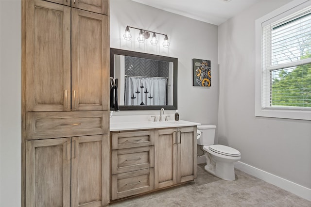 full bath with a shower with shower curtain, toilet, vanity, and baseboards