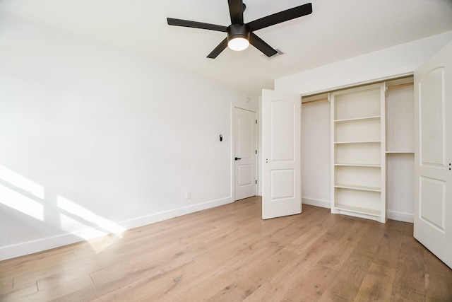 unfurnished bedroom featuring visible vents, baseboards, ceiling fan, a closet, and light wood-type flooring