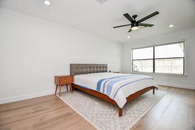 bedroom with recessed lighting, baseboards, light wood-style floors, and a ceiling fan