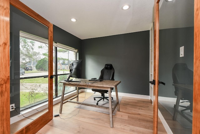 office space with recessed lighting, baseboards, and light wood-style flooring