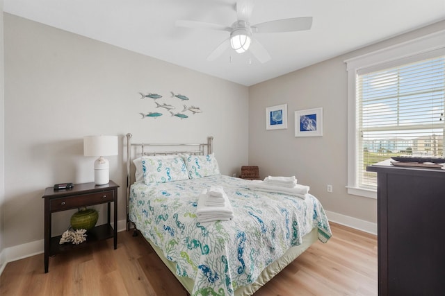 26501 Mangrove Dr Unit 203, Galveston, TX 77554 - bedroom with wood finished floors and ceiling fan