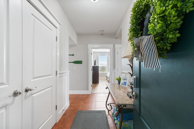 26501 Mangrove Dr Unit 203, Galveston, TX 77554 - hallway featuring tile patterned flooring and baseboards