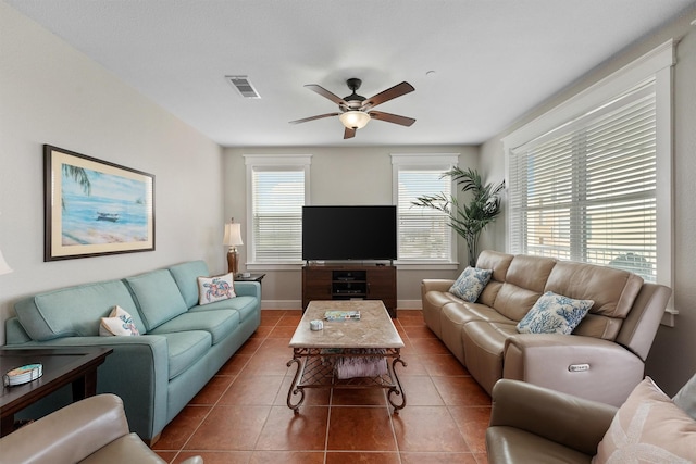 26501 Mangrove Dr Unit 203, Galveston, TX 77554 - tiled living area with a ceiling fan and baseboards