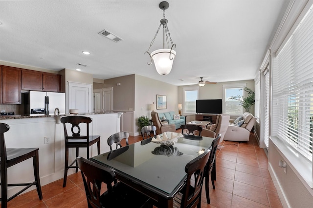 26501 Mangrove Dr Unit 203, Galveston, TX 77554 - dining space featuring tile patterned flooring, ceiling fan, and recessed lighting