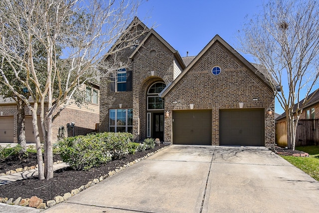 view of front facade with a garage, brick siding, and driveway