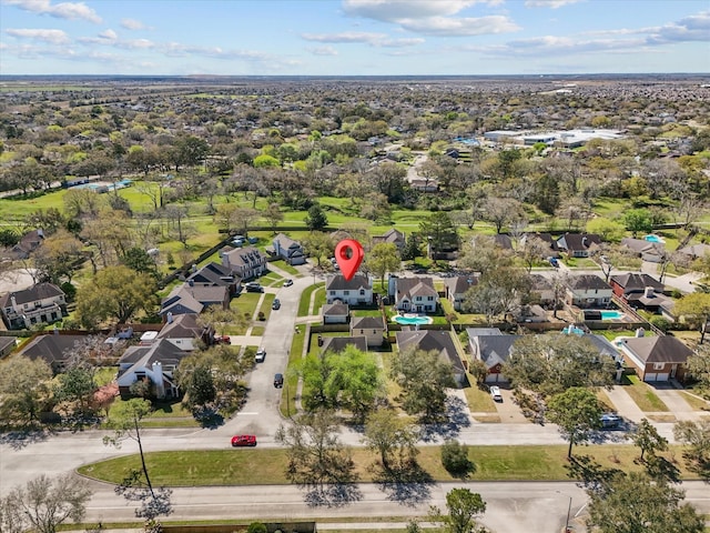 birds eye view of property with a residential view