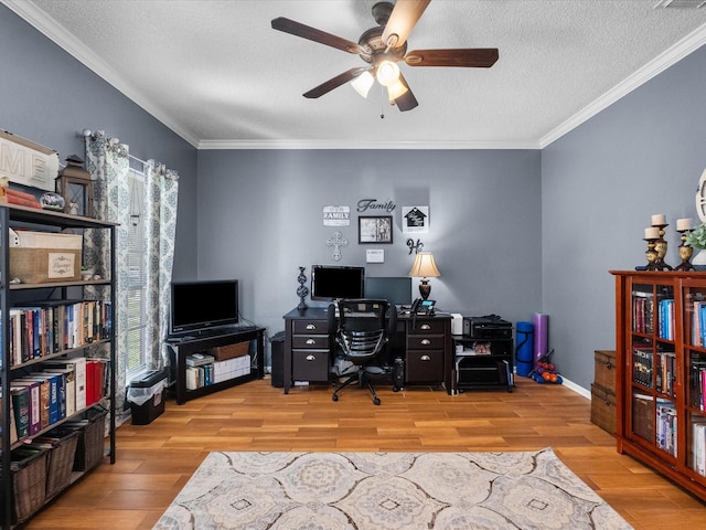 office space featuring crown molding, ceiling fan, and wood finished floors