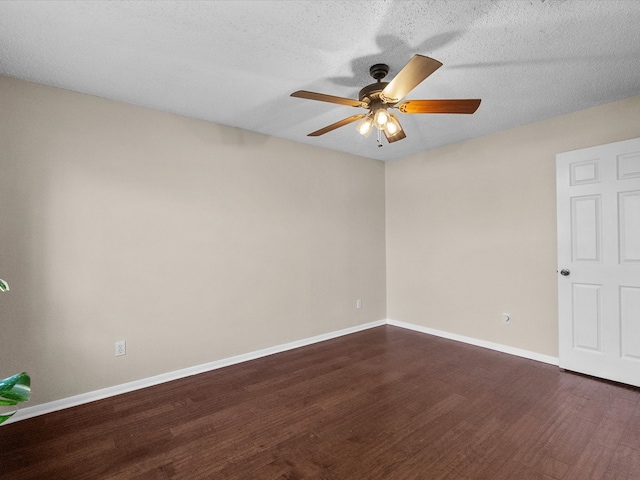 unfurnished room featuring ceiling fan, baseboards, a textured ceiling, and dark wood finished floors