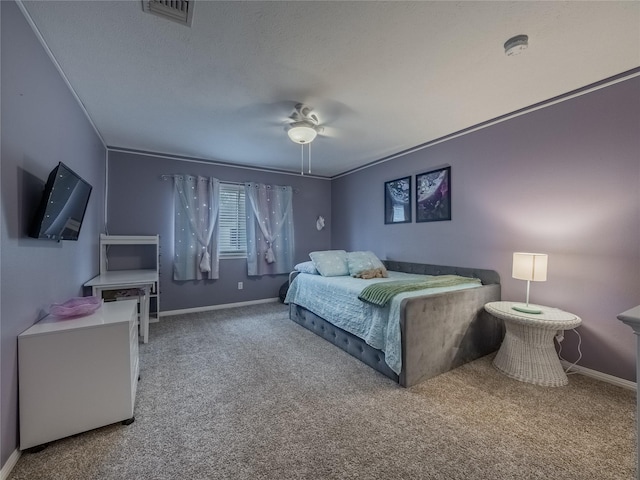 bedroom featuring visible vents, baseboards, carpet flooring, a textured ceiling, and a ceiling fan