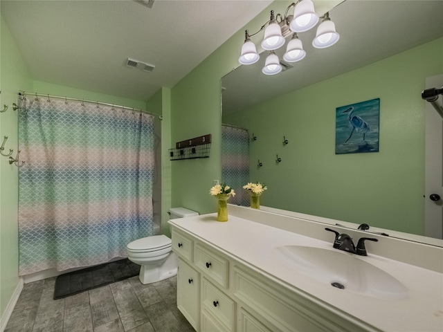 full bath with visible vents, toilet, and vanity