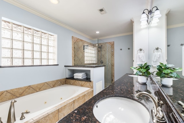 full bath with visible vents, a sink, a tub with jets, a shower stall, and crown molding