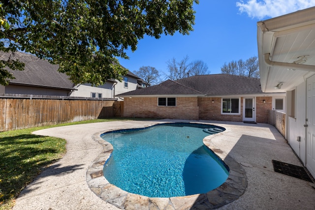 view of swimming pool with a fenced in pool, a fenced backyard, and a patio area