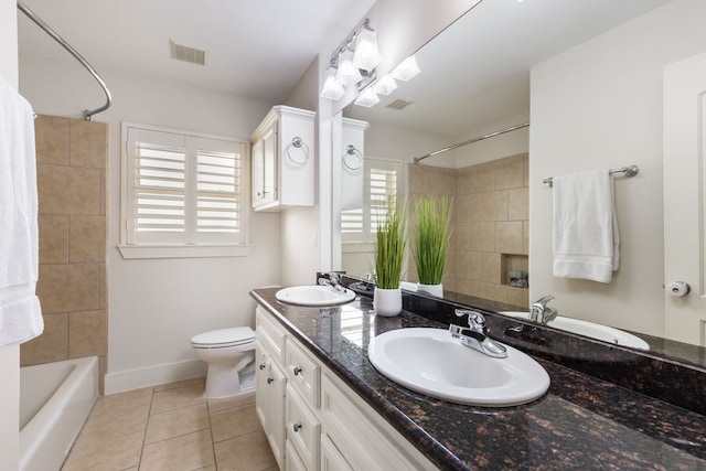 full bath with a sink, visible vents, and tile patterned flooring