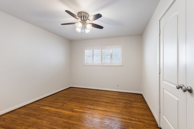 interior space featuring dark wood finished floors, baseboards, and ceiling fan