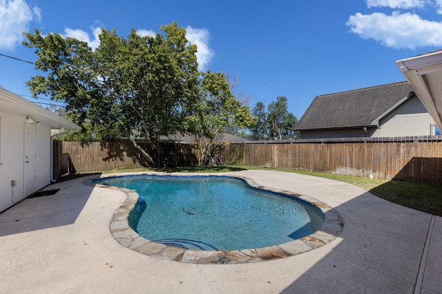 view of swimming pool featuring a patio area, a fenced in pool, and a fenced backyard