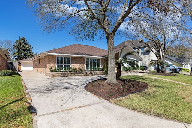 ranch-style house featuring a front yard, a garage, brick siding, and driveway