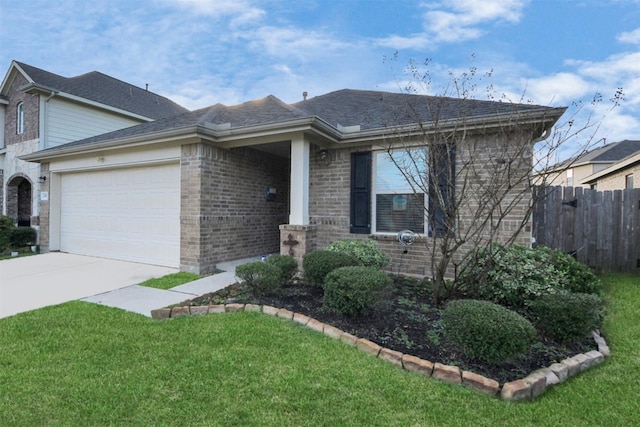 single story home with driveway, fence, a front yard, an attached garage, and brick siding