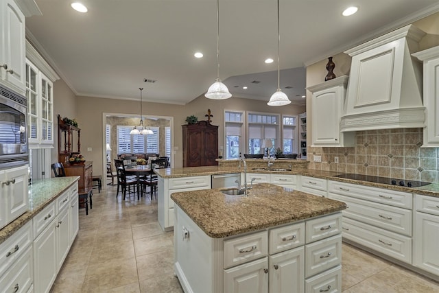 kitchen with backsplash, appliances with stainless steel finishes, crown molding, and custom range hood