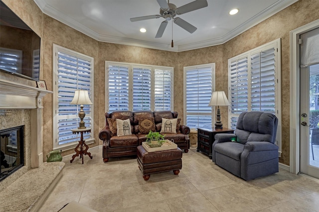 tiled living room with a ceiling fan, baseboards, recessed lighting, a fireplace, and crown molding